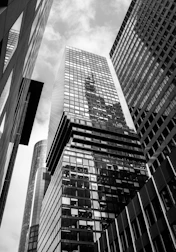 a black and white photo of tall buildings