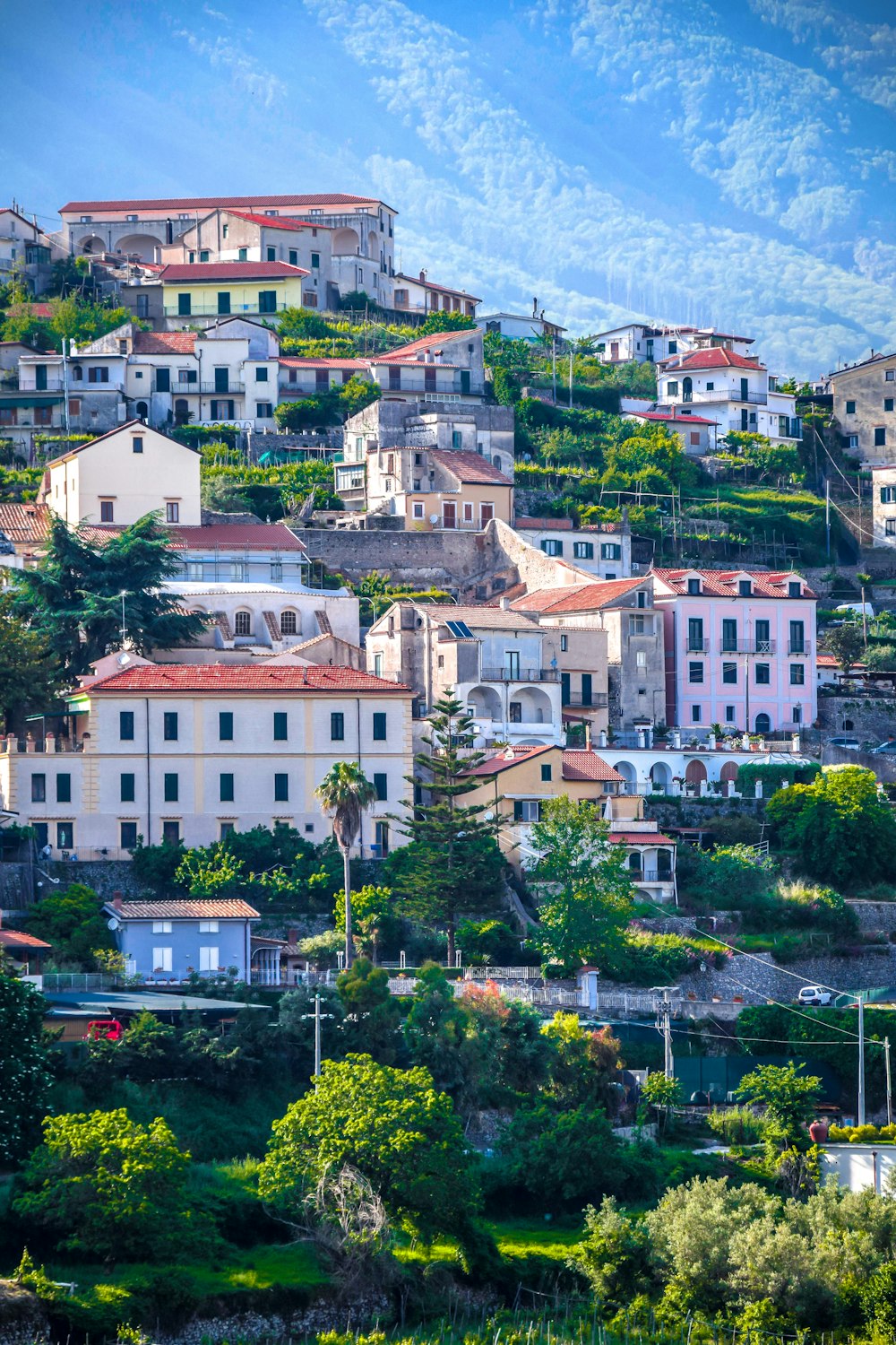 a hillside with many houses on top of it