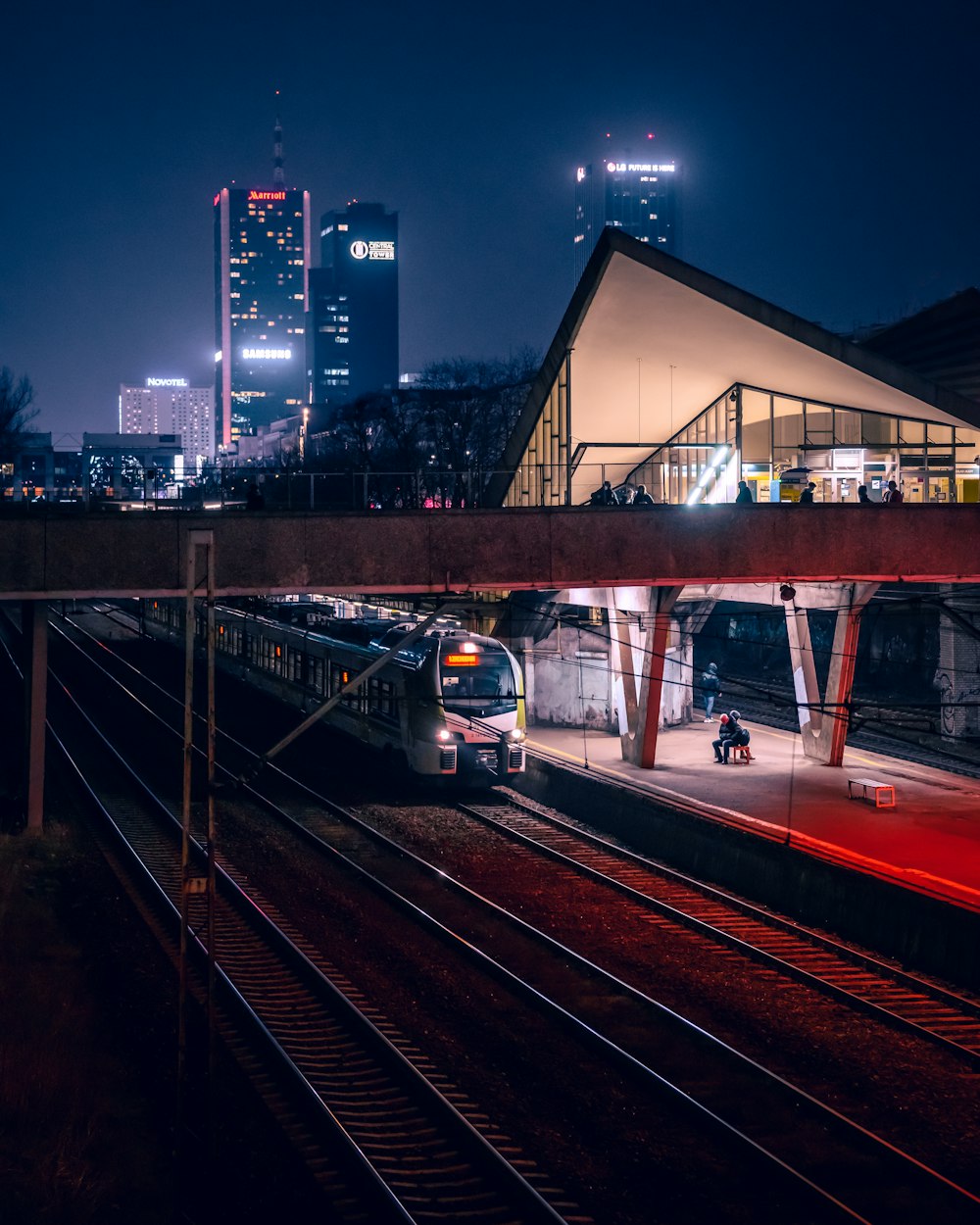 a train on a train track at night