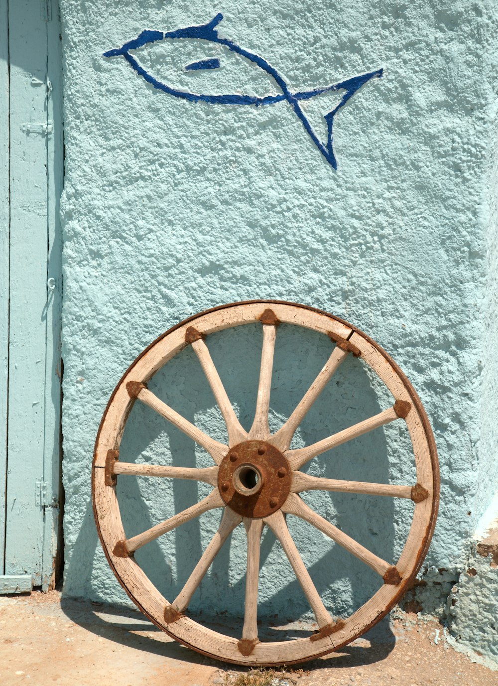 a fish drawn on the side of a building