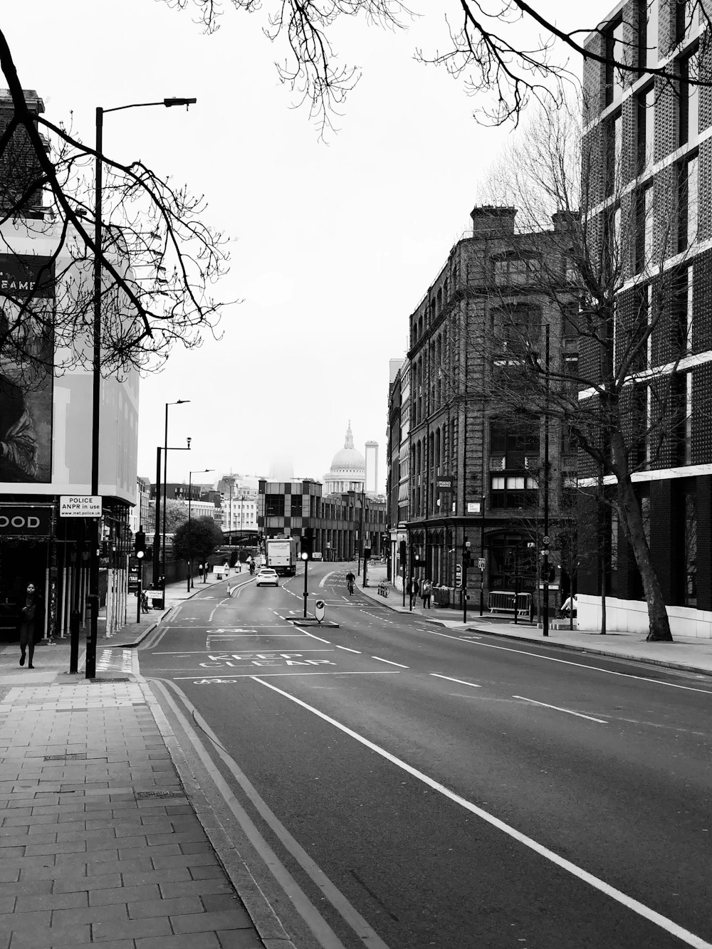 a black and white photo of a city street