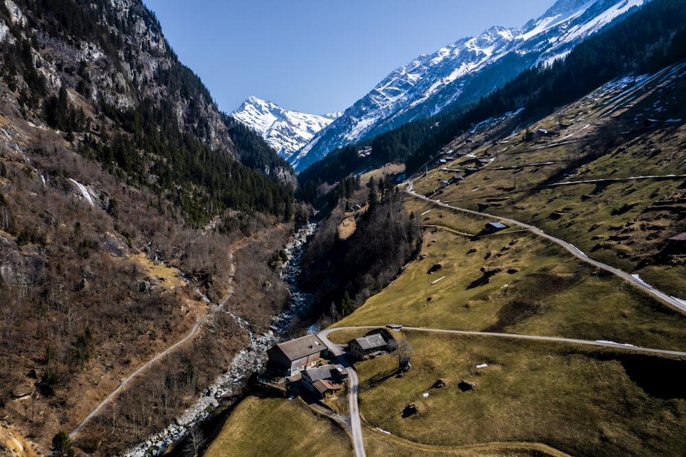 an aerial view of a house in the mountains