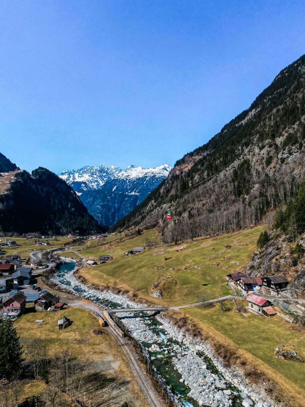 a scenic view of a valley with a river running through it