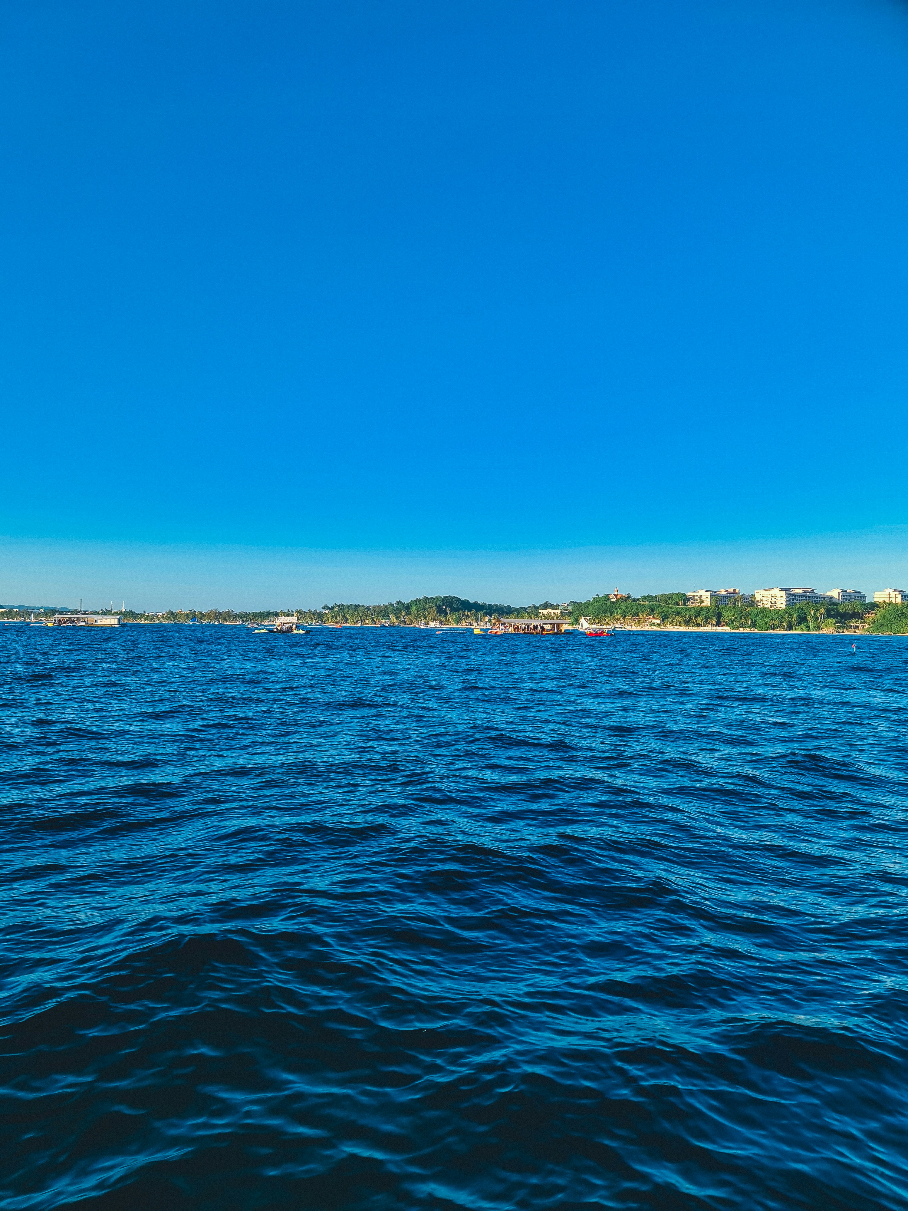 a body of water with a small island in the distance