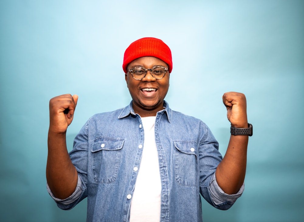 a man wearing a red hat and glasses