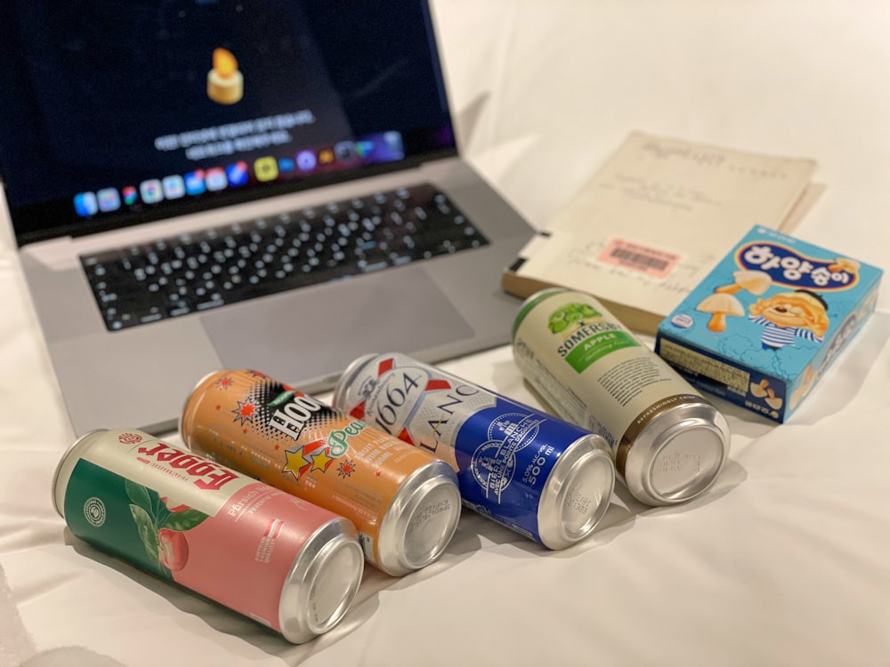 a laptop computer sitting on top of a bed