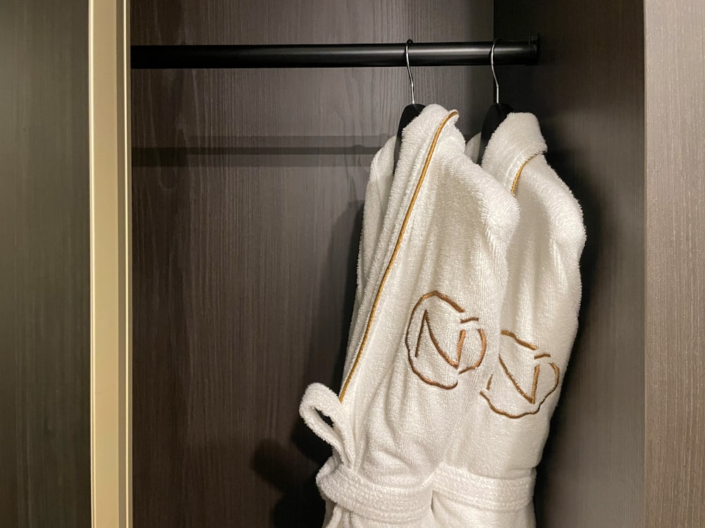 a towel hanging on a rack in a closet