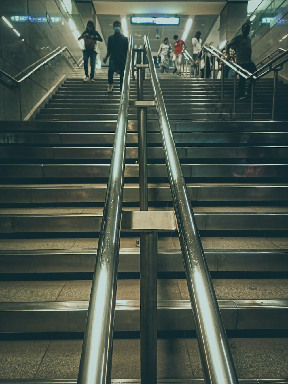 a group of people walking down a flight of stairs