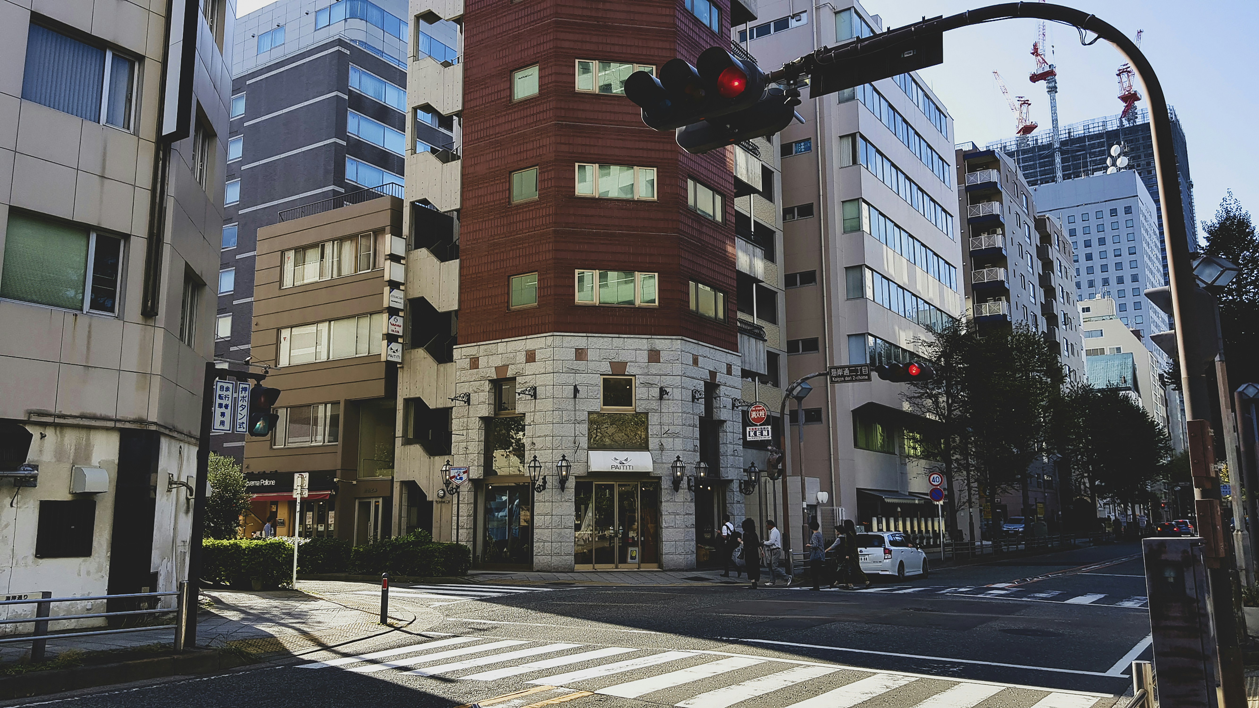 a traffic light on a city street next to tall buildings