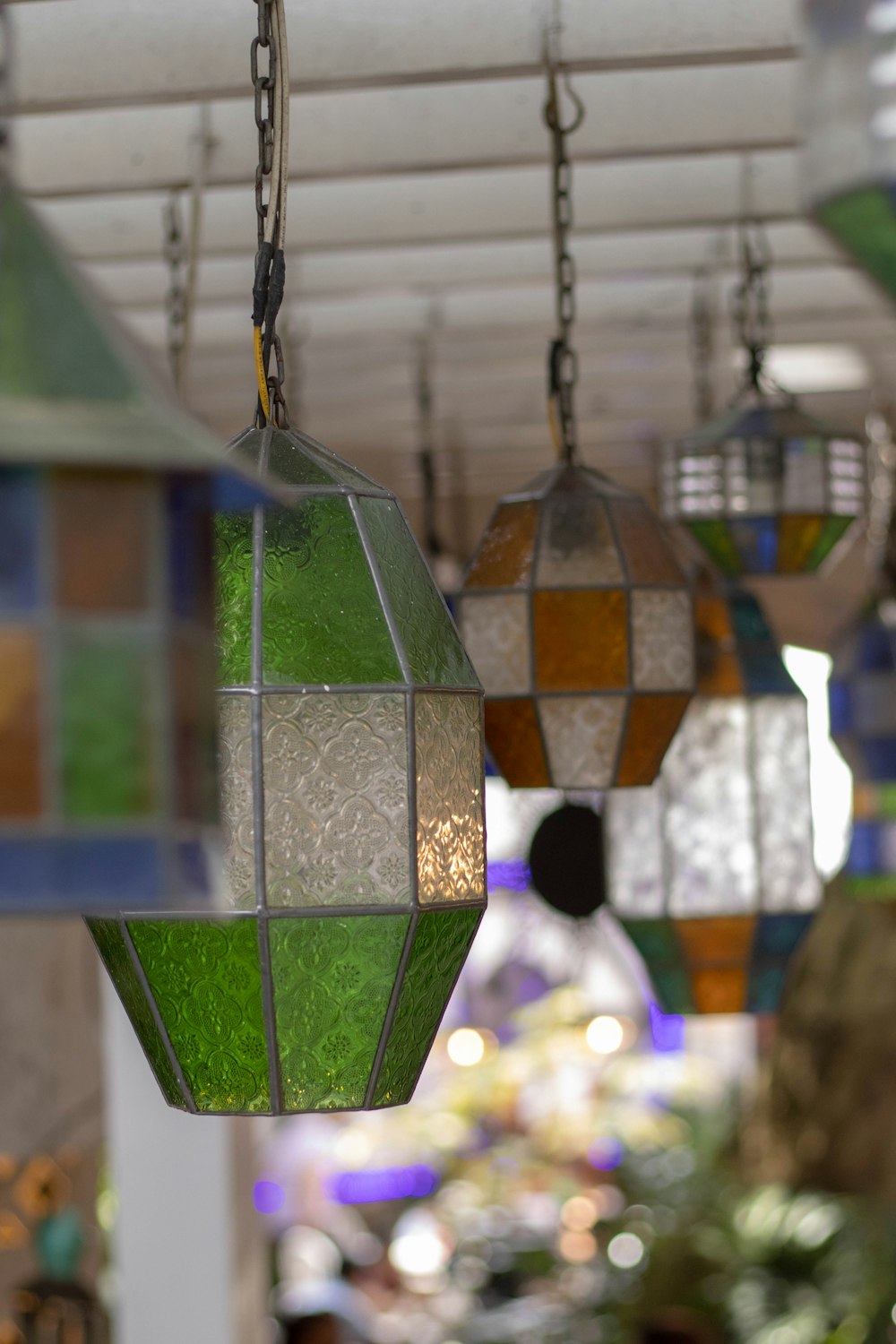 a group of colorful lights hanging from a ceiling