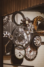 a bunch of clocks that are on a wall