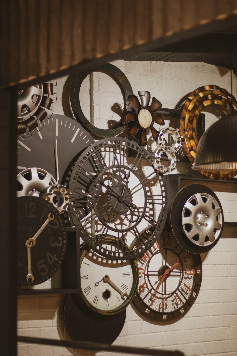 a bunch of clocks that are on a wall