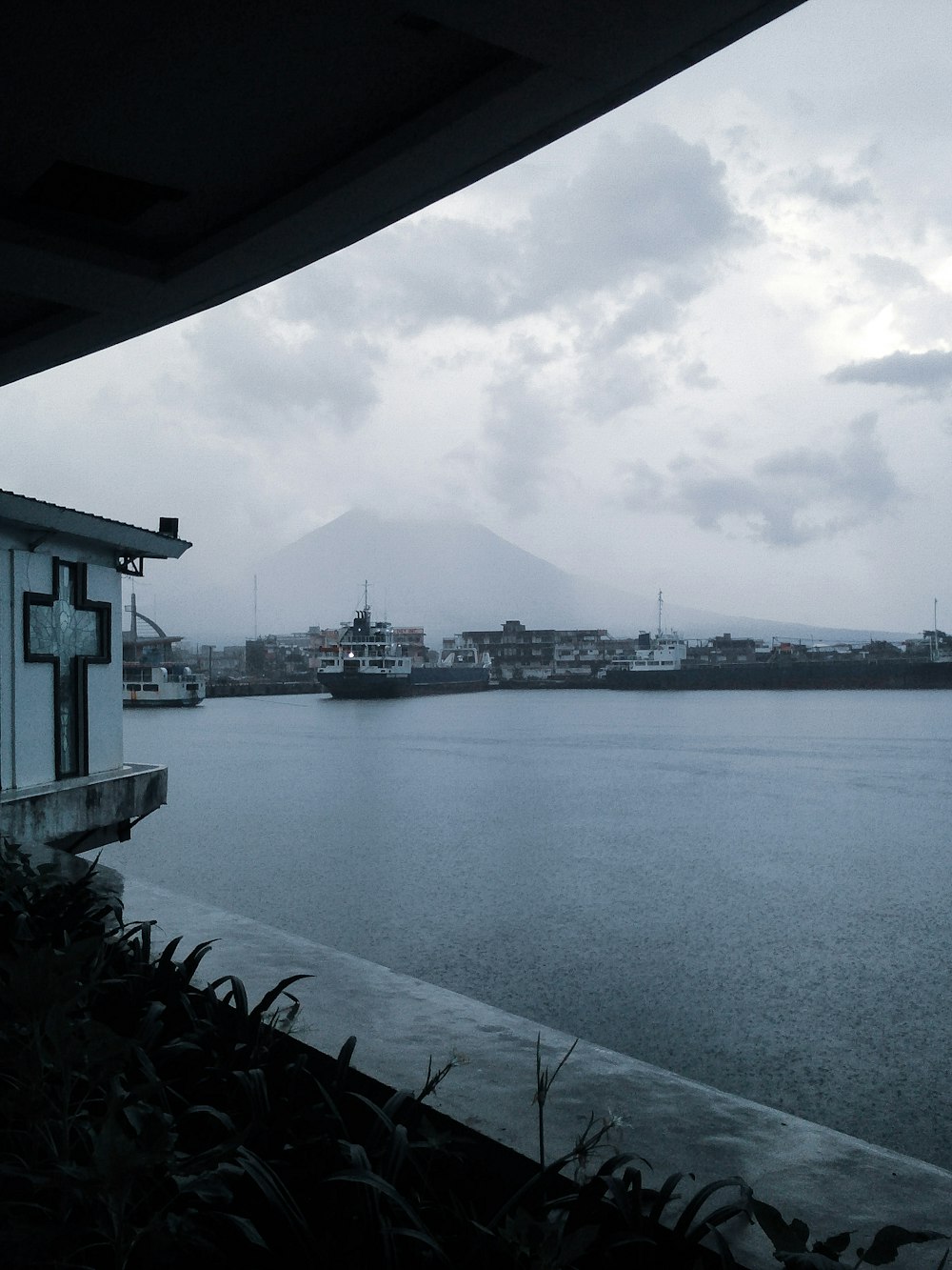 a body of water with a mountain in the background