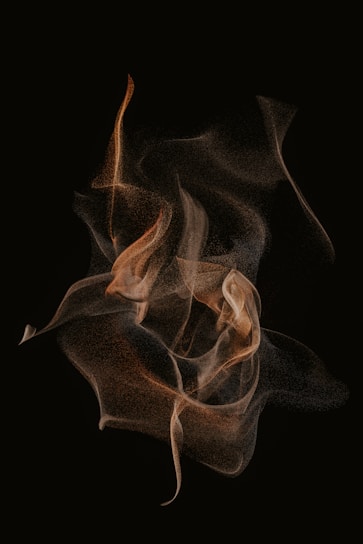 Abstract dark shapes flowing seamlessly, hinting at motion and creativity.