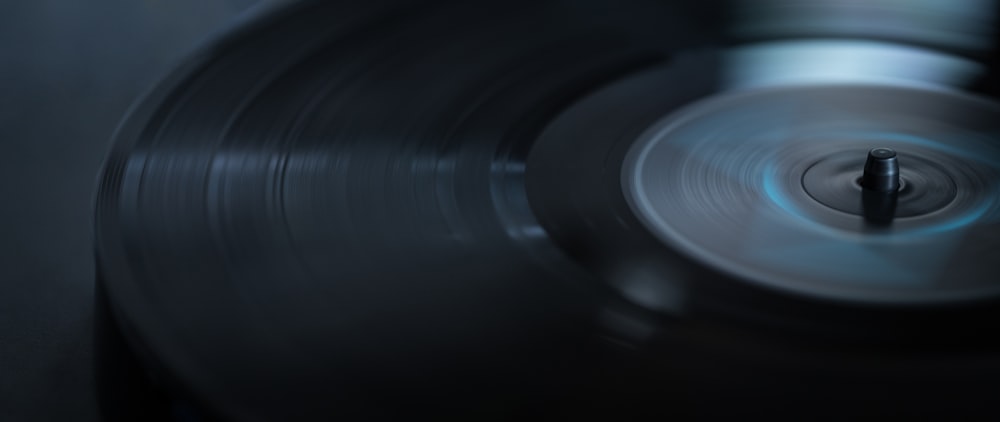 a close up of a turntable with a blurry background