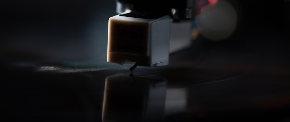 a close up of a coffee maker on a table