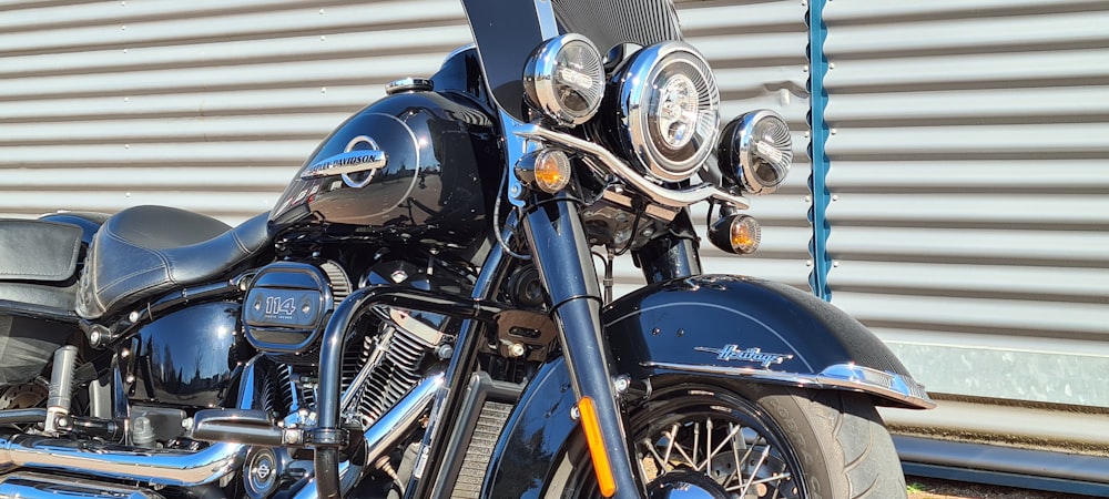 a black motorcycle parked in front of a building