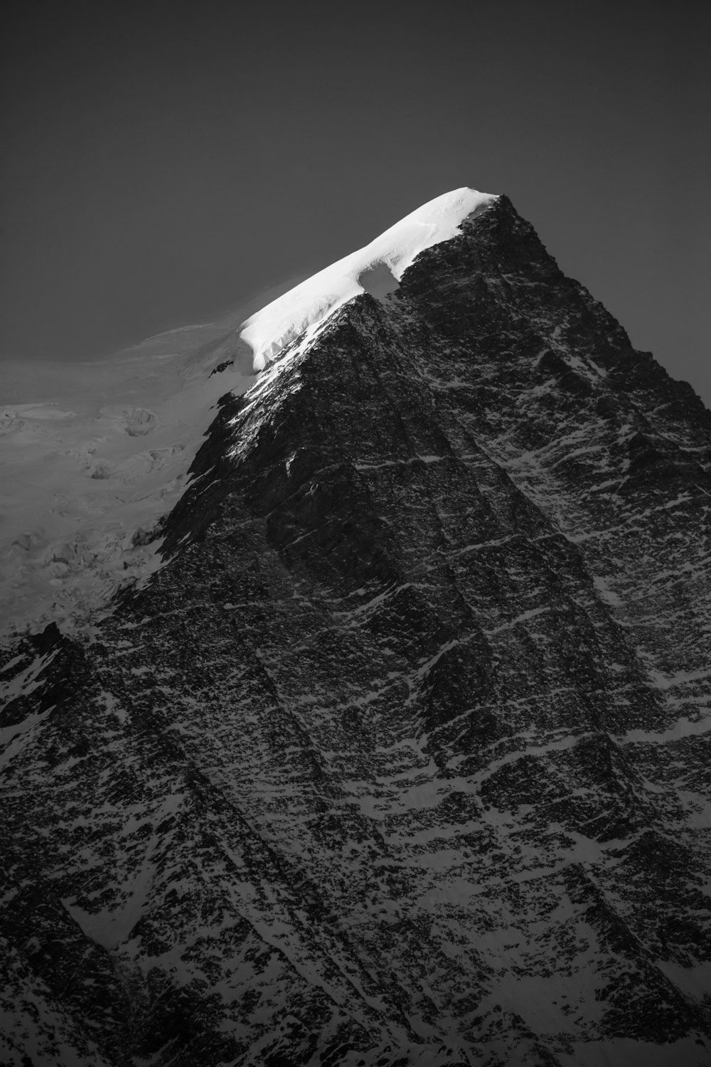 a very tall mountain with a snow covered top