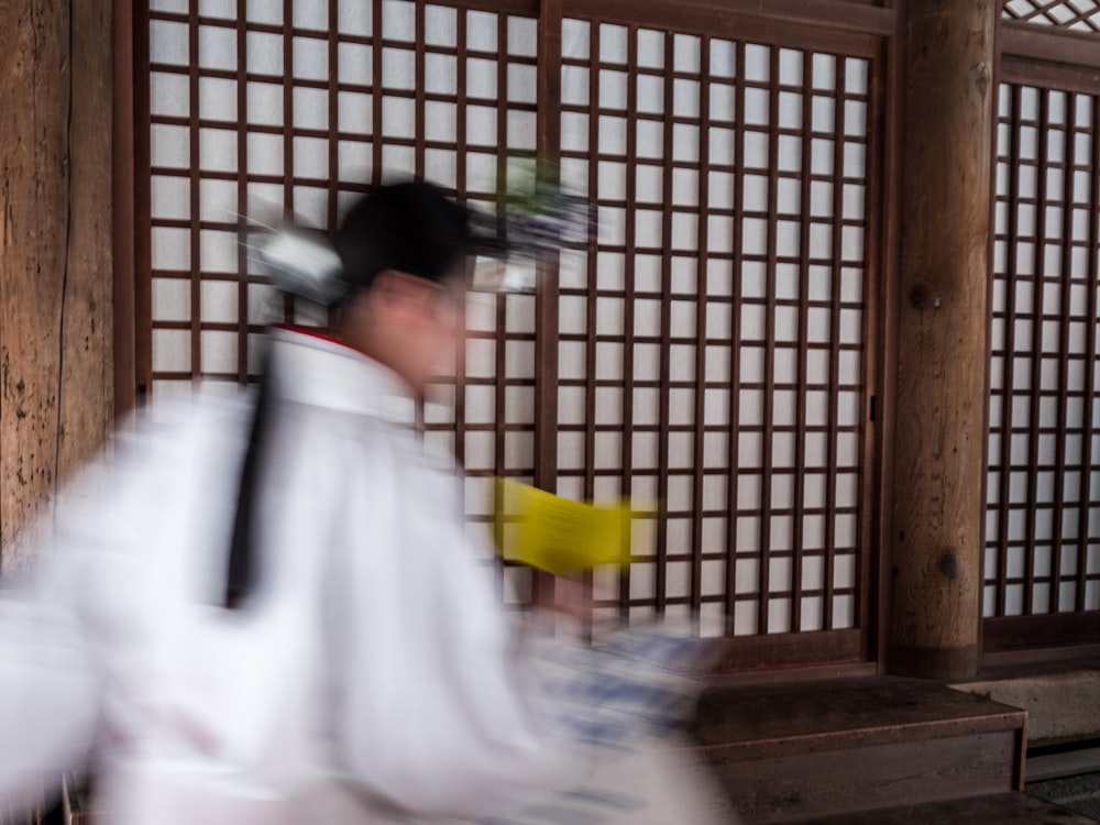 a blurry photo of a man in a kimono