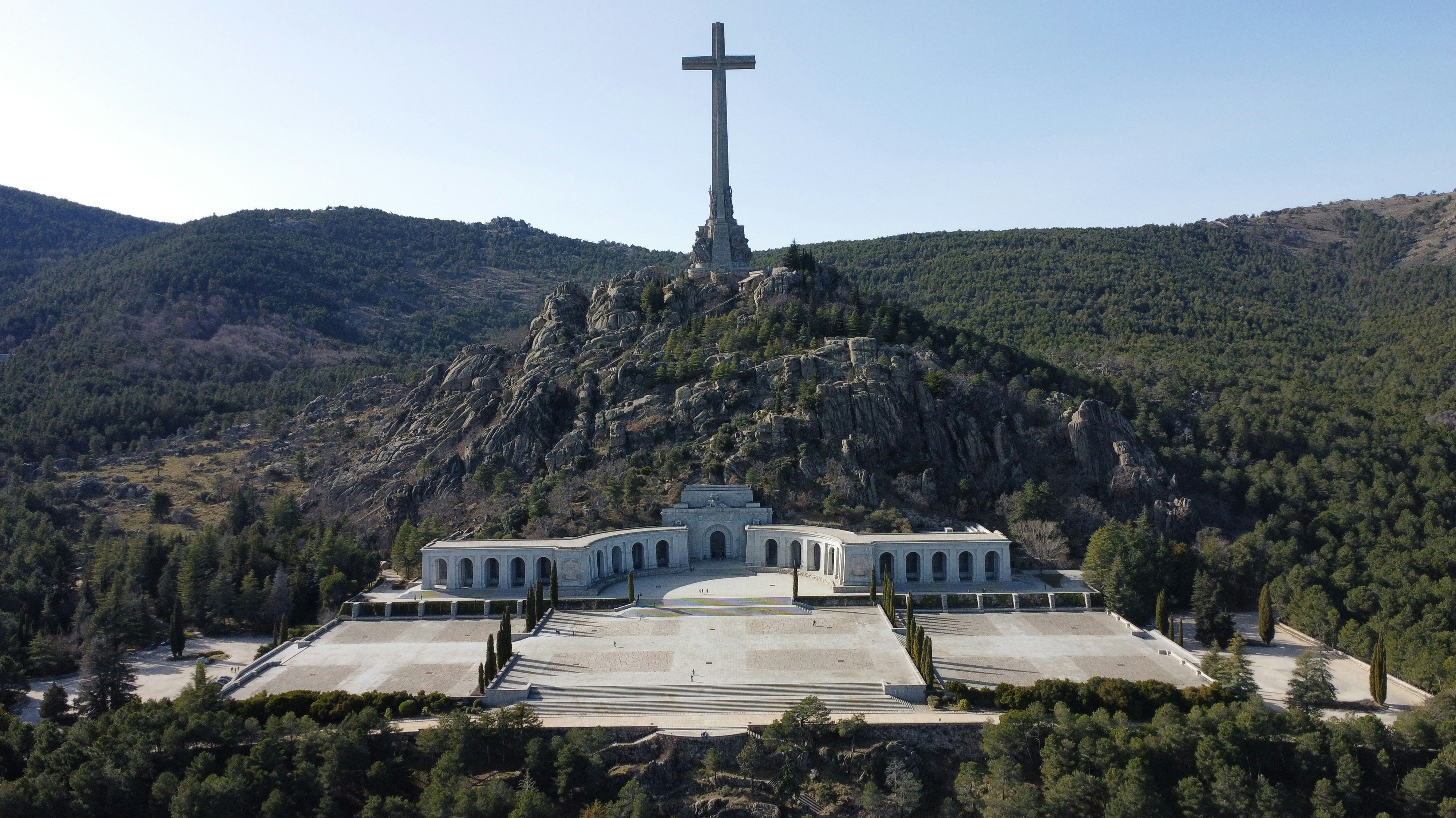 a large white building with a cross on top of it