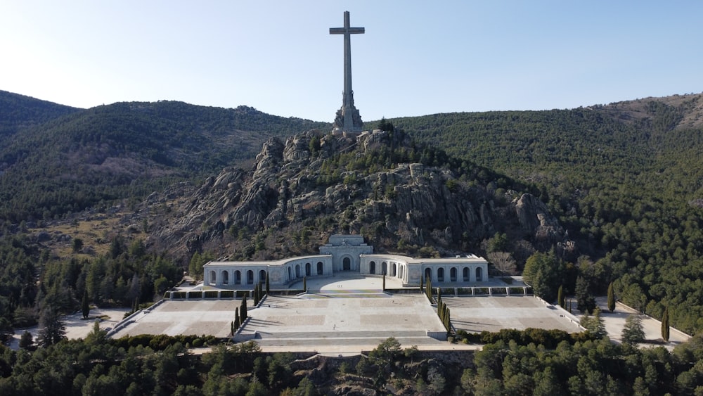 a large white building with a cross on top of it