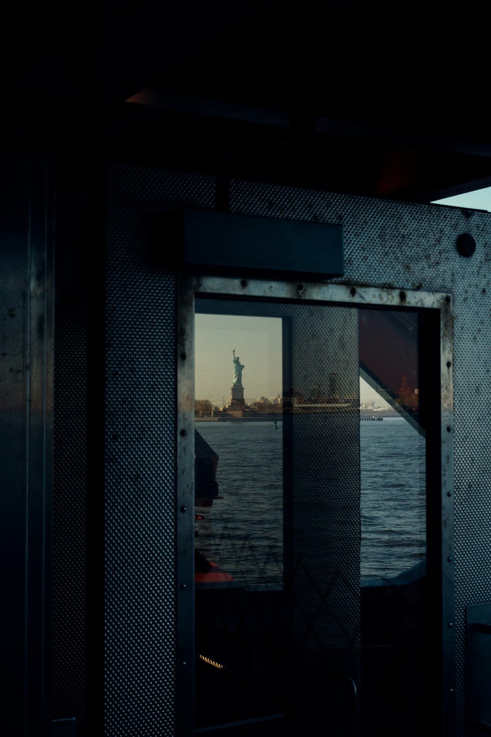 a view of the statue of liberty from a boat