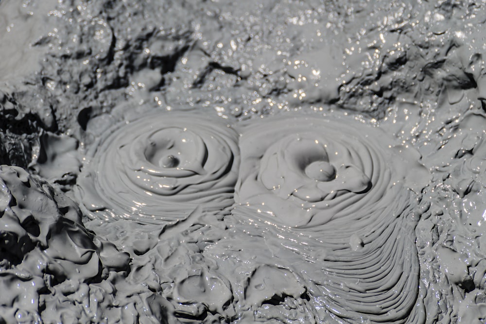 a close up of a rock with water on it