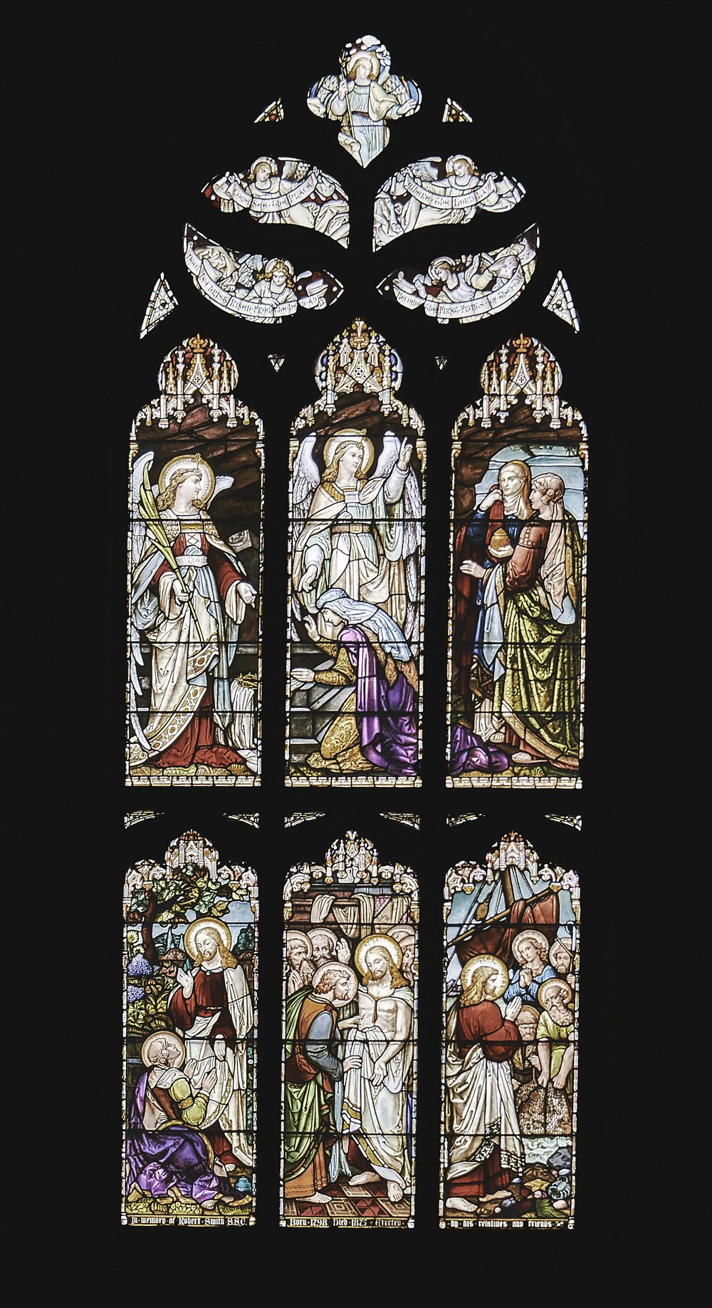 a stained glass window depicting the birth of jesus