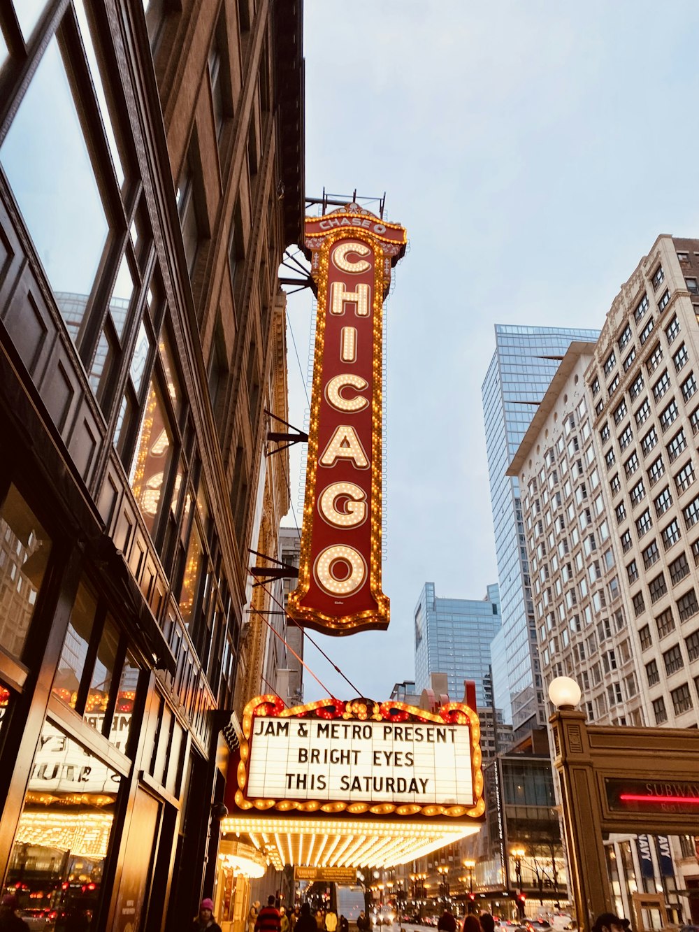 a chicago theater marquee hanging from the side of a building