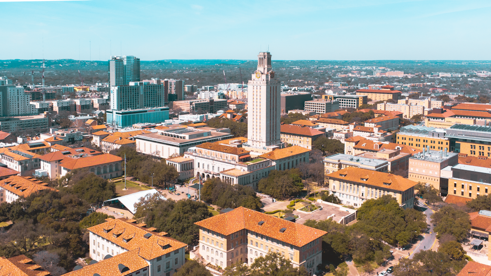 an aerial view of a city with tall buildings