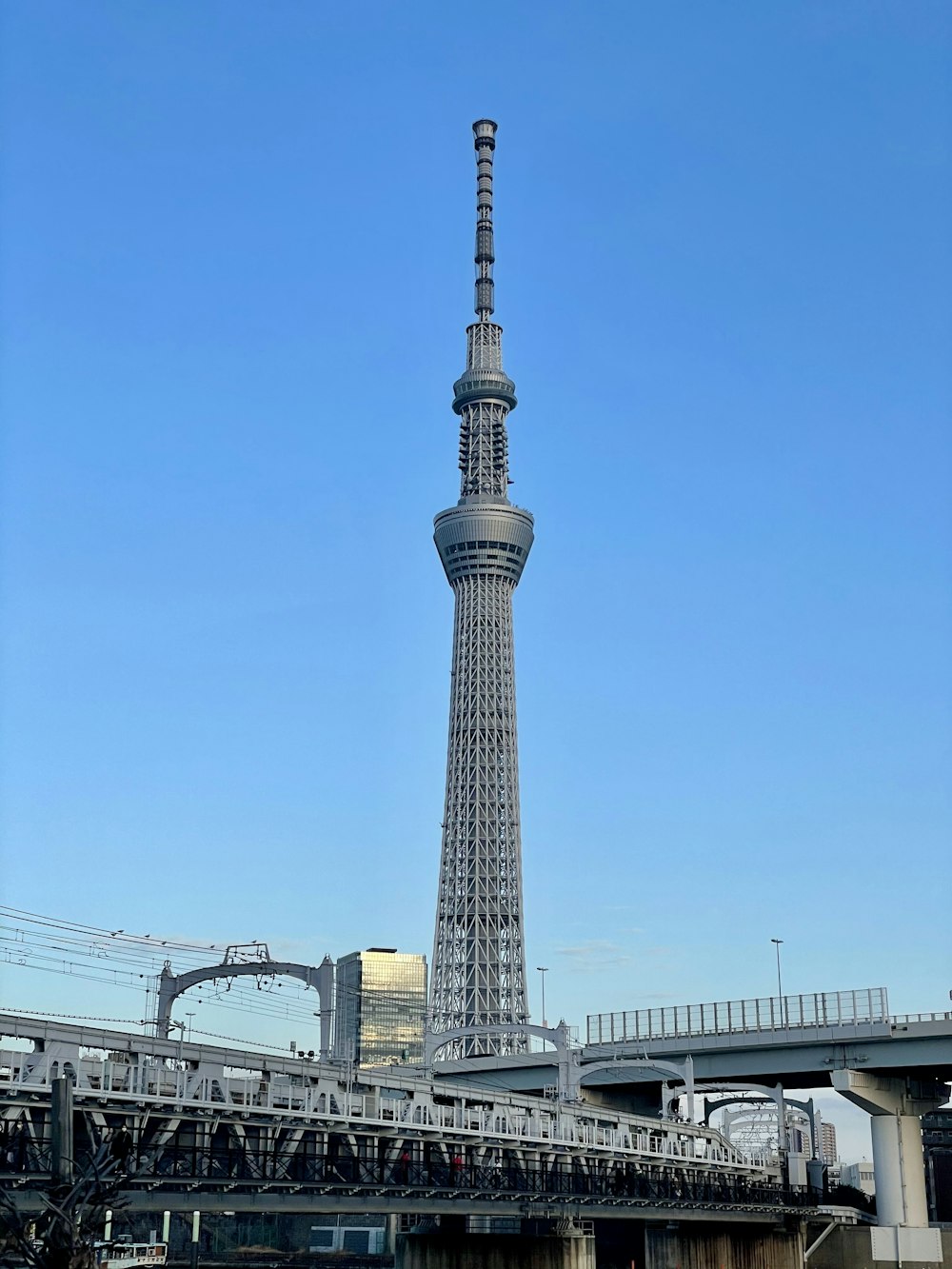 a very tall tower towering over a city