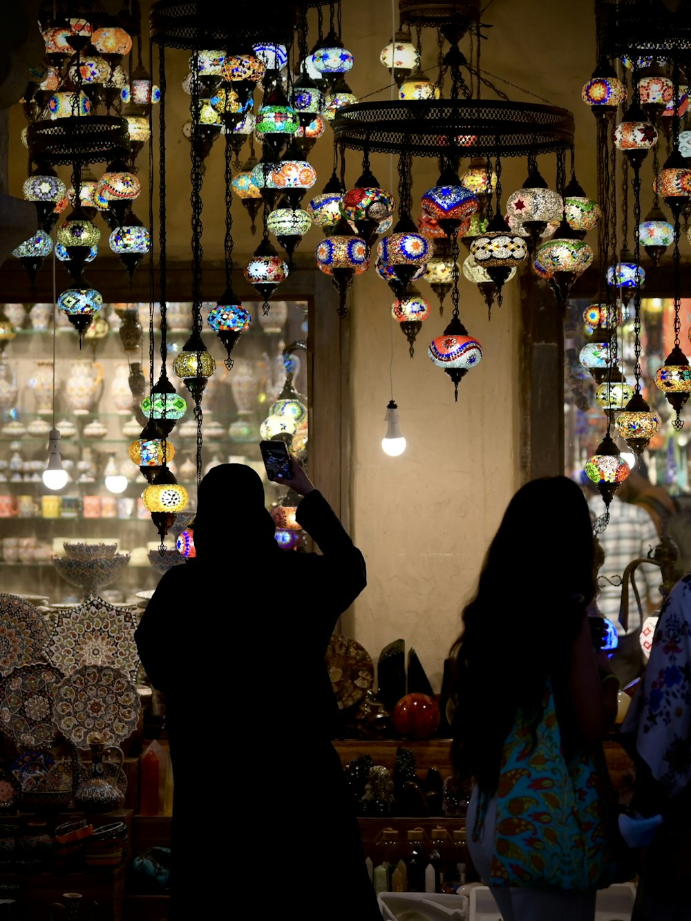 a group of people standing in front of a store