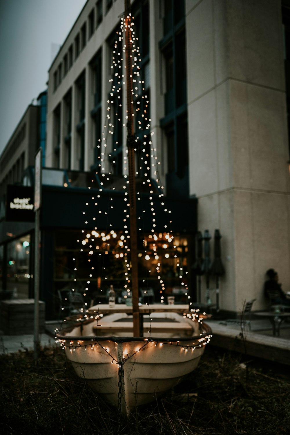 a boat with a christmas tree on top of it