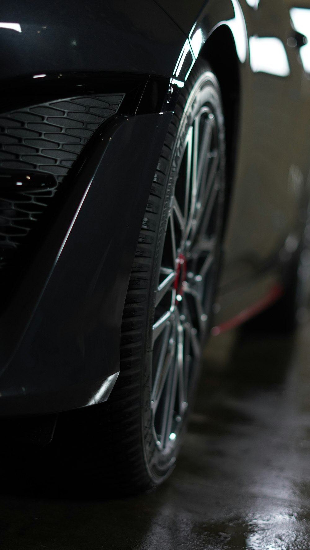 a close up of the front of a black sports car