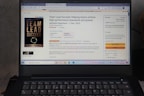 A laptop displays an Amazon product page for the book 'Team Lead Succeed'. The book cover is visible on the left, highlighting the title in bold letters. The page shows options to purchase in paperback or Kindle format, with price details and shipping options. The background includes a promotional message and a quote from the book.