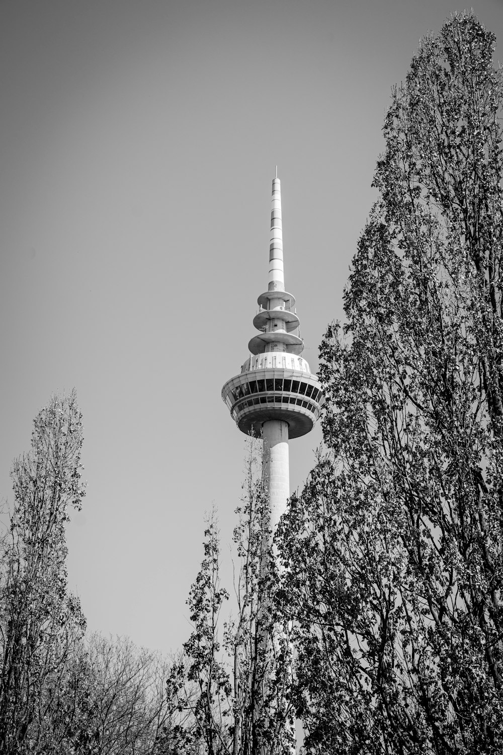 a black and white photo of a tall tower