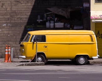 a yellow van parked on the side of the road