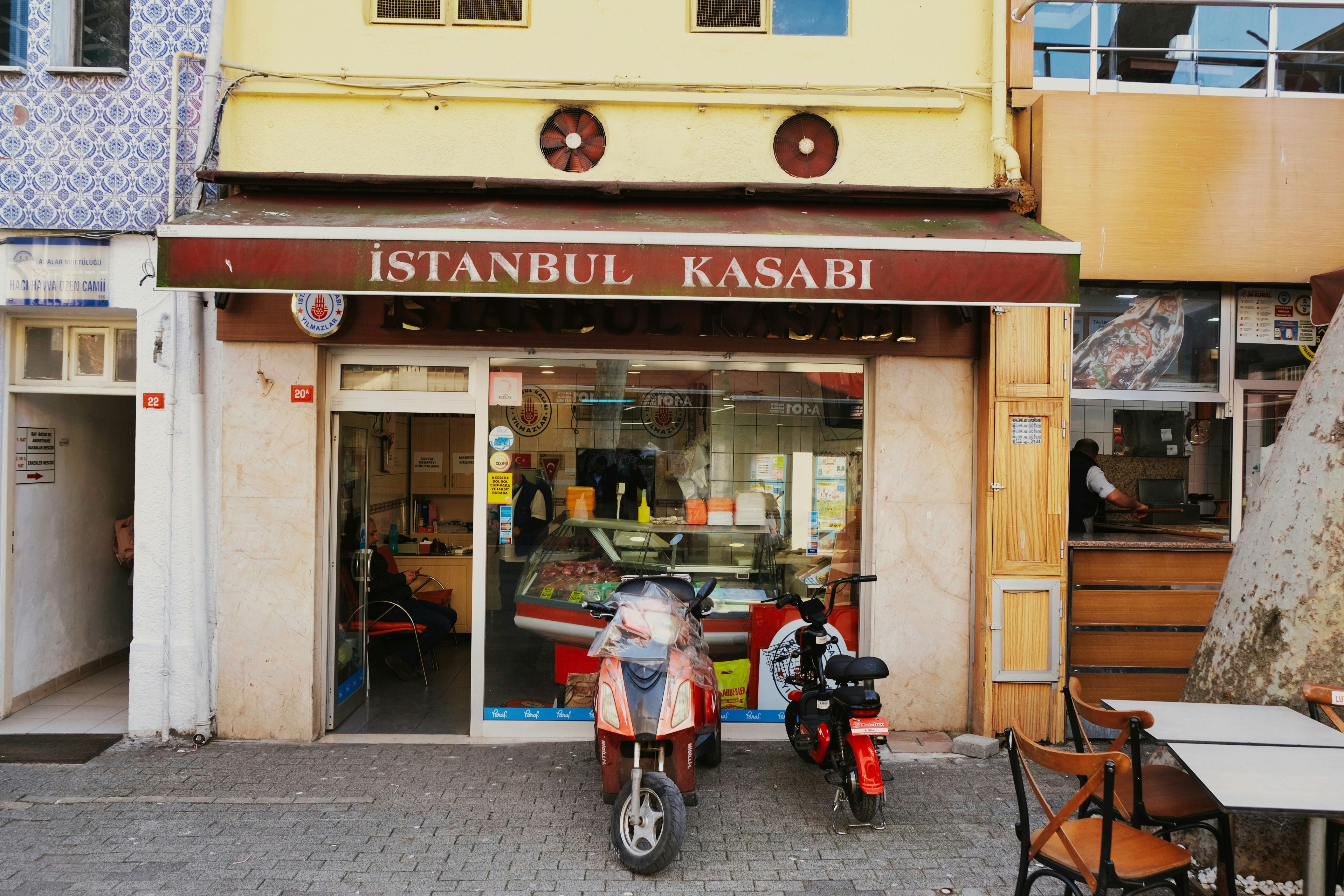 a motorcycle parked in front of a restaurant