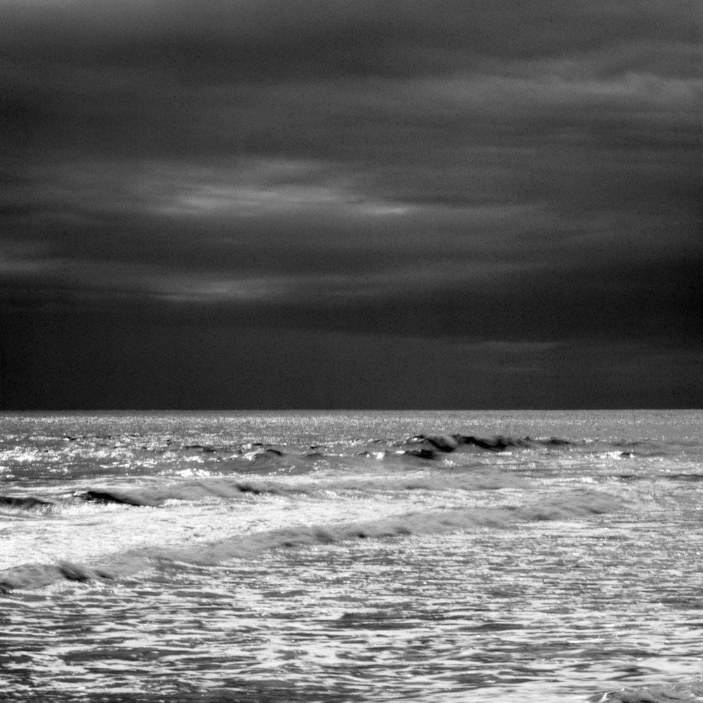 a black and white photo of the ocean