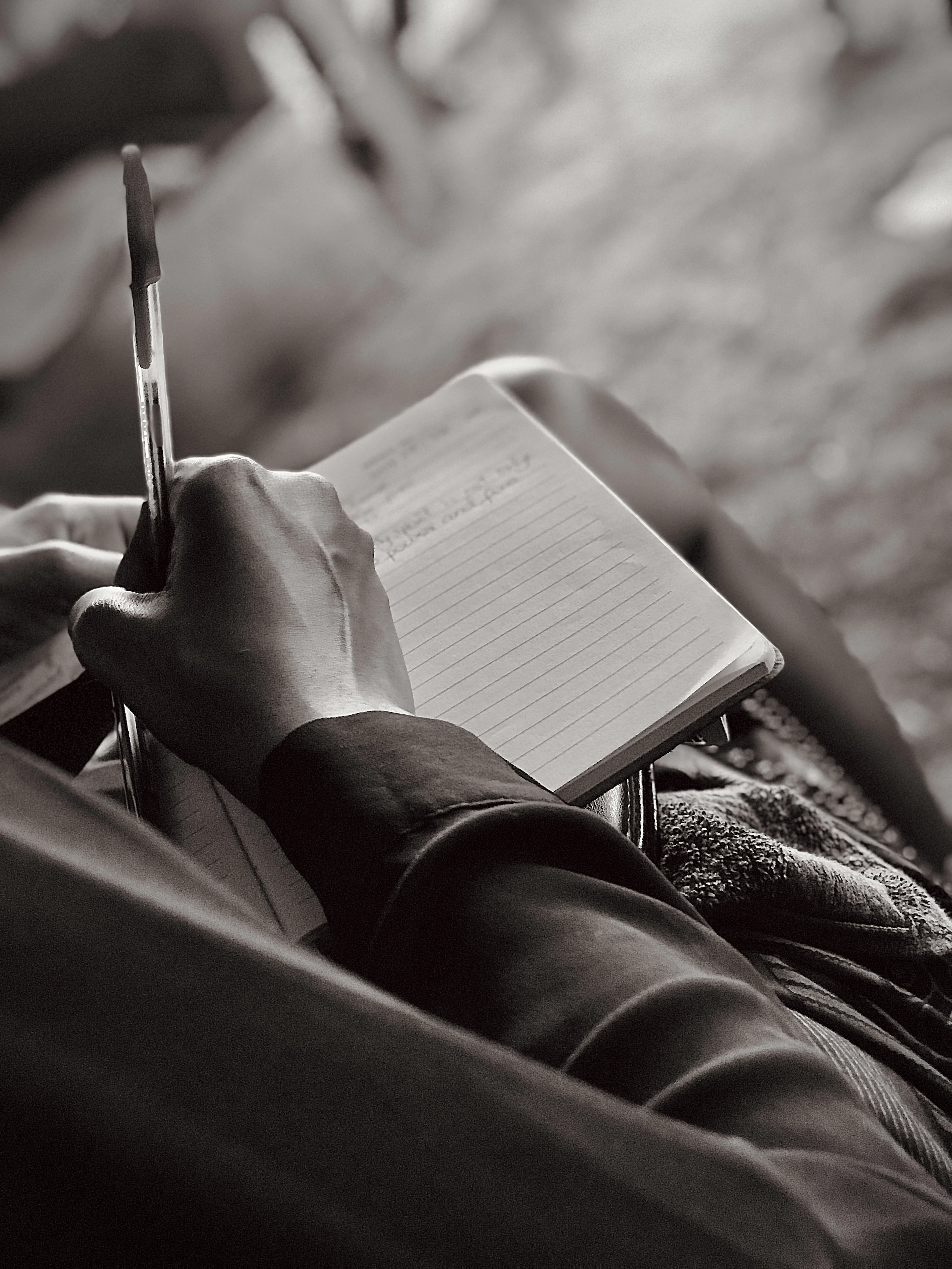 A Black African writer making notes by hand in Accra, Ghana