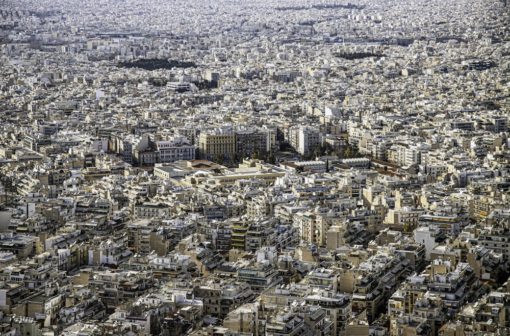 an aerial view of a city with lots of tall buildings