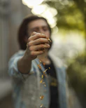 a woman holding a handful of food in her hands