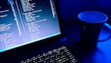a computer monitor and keyboard on a desk