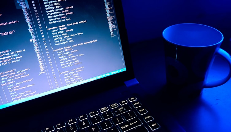 a computer monitor and keyboard on a desk