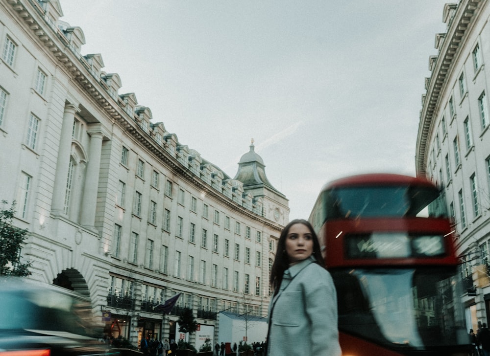 a woman standing in the middle of a street