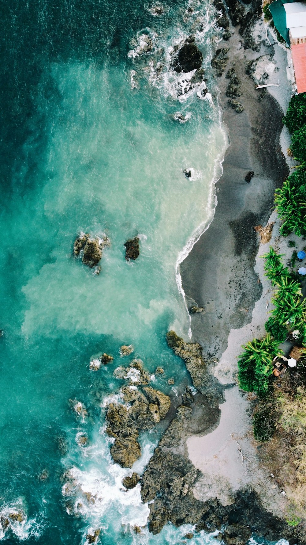 an aerial view of a beach and a body of water