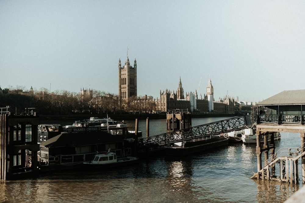 a boat traveling down a river next to a bridge