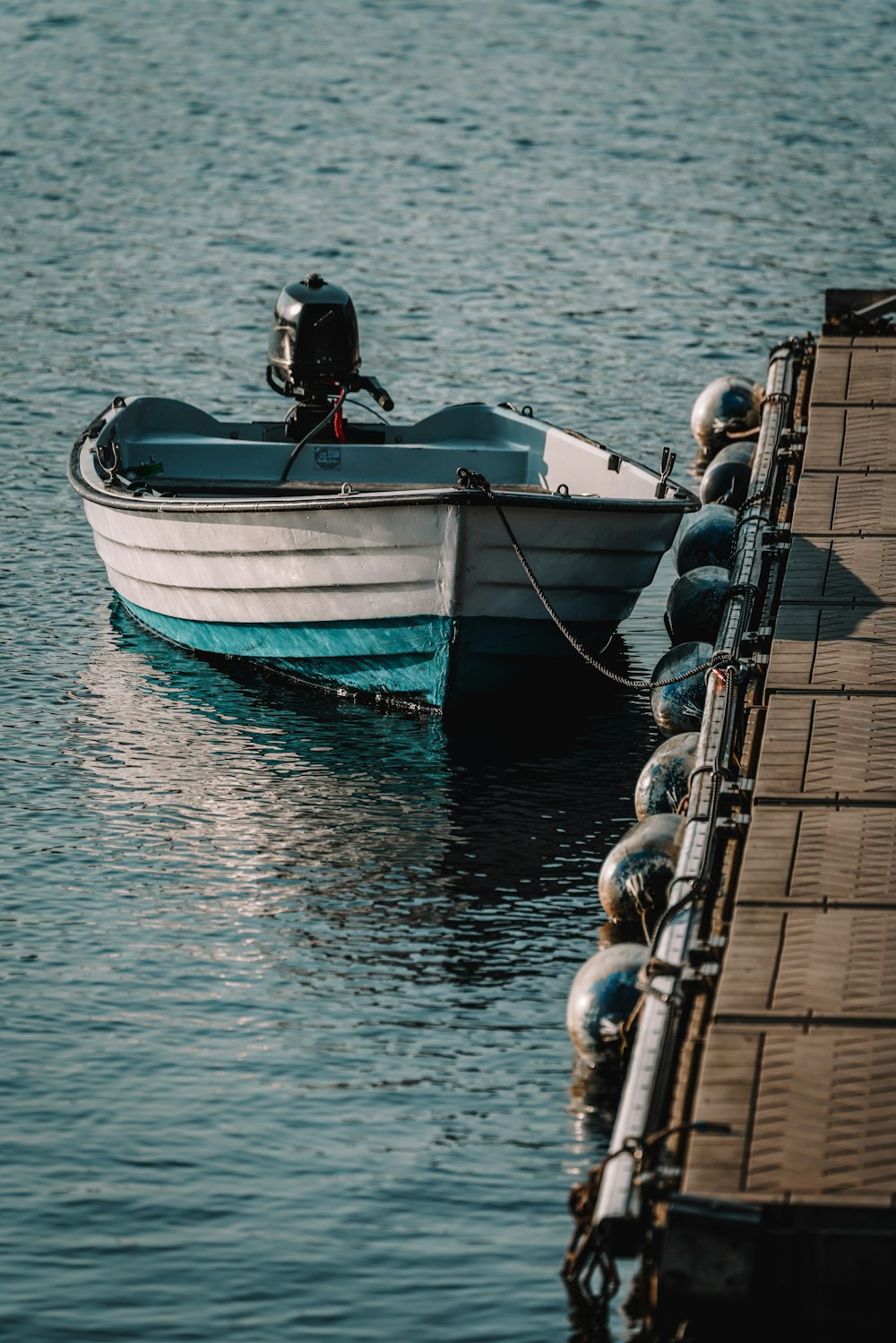 a small boat is tied to a dock