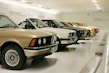 A favourites page displaying multiple cars with photos, names, prices, and clear remove buttons.