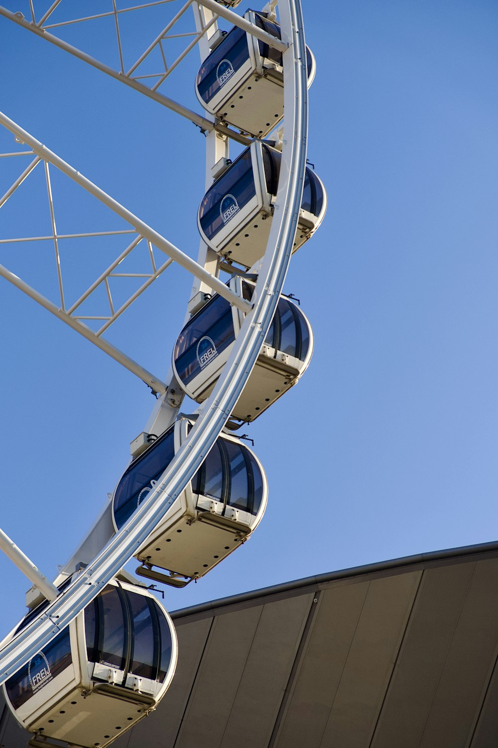 a ferris wheel is shown against a blue sky